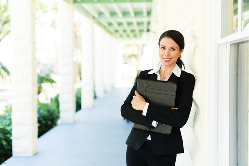 Real estate women smiling because she's getting more leads